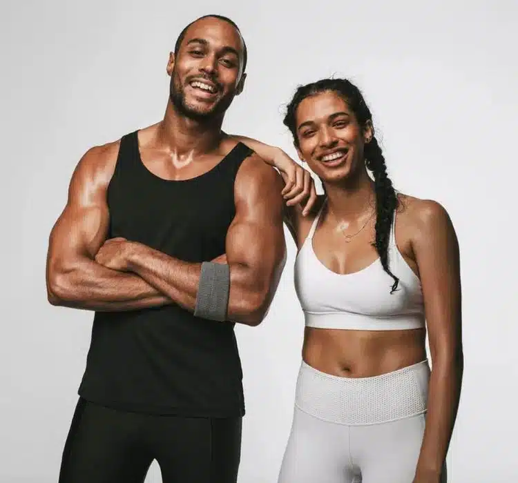 A photo of a couple with fit and well sculpted bodies.