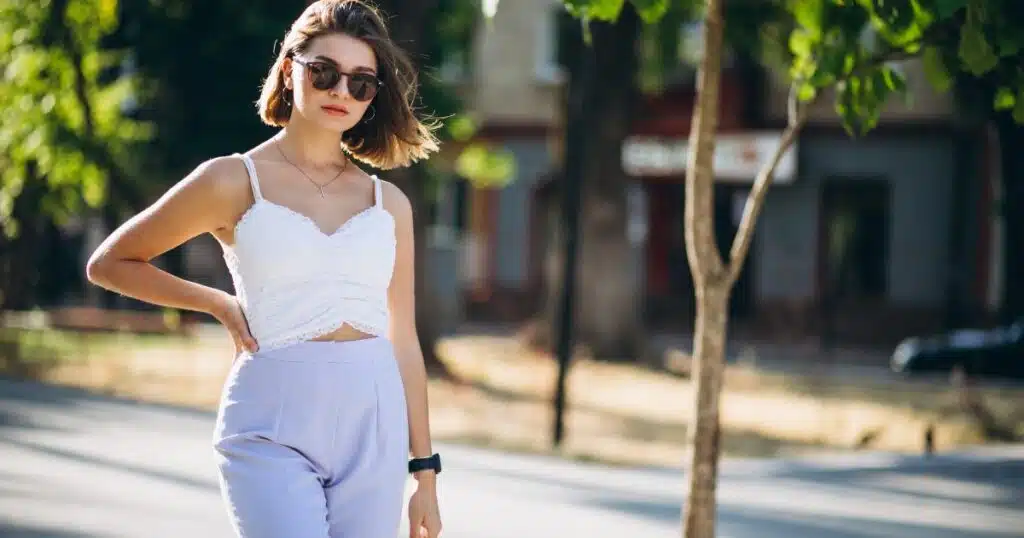 woman strolling outside with sunglasses